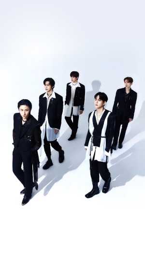 Monsta X members in black and white outfits