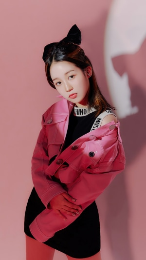 Kep1er's Hikaru in a pink jacket and black dress