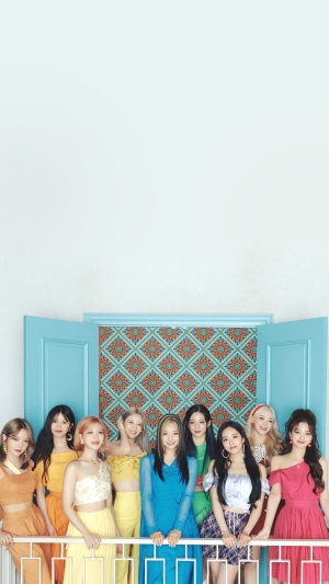 Fromis 9 Kpop group posing in colorful outfits