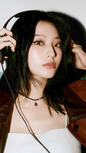 Lee Saerom from Fromis 9 with headphones