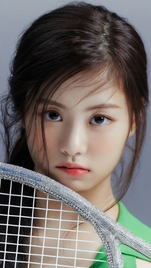 Kim Garam from LE SSERAFIM holding a tennis racket