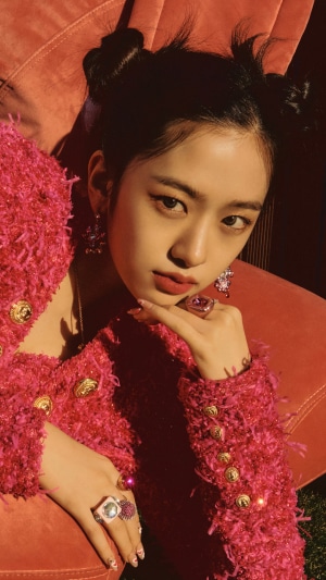 Yujin in a pink fuzzy outfit