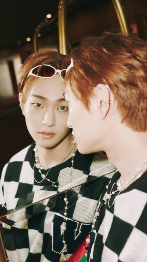 Onew Lee Jin-ki wearing sunglasses and checkered sweater