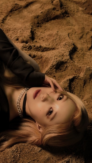 Handong from Dreamcatcher lying on sand