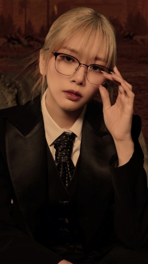 JiU from Dreamcatcher wearing glasses and a suit