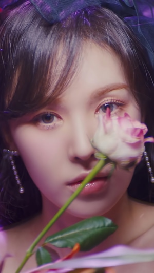 Wendy from Red Velvet holding a rose
