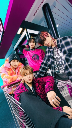 NCT DREAM members in a shopping cart