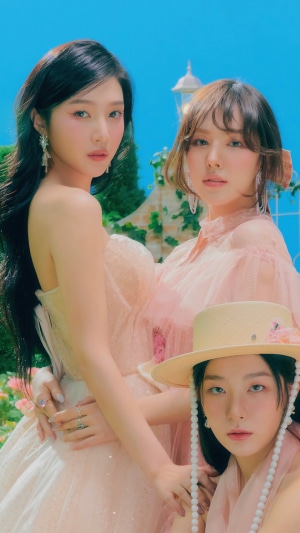 Red Velvet's Joy, Wendy, and Seulgi in a garden
