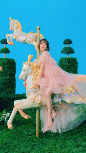 Wendy from Red Velvet on a carousel horse