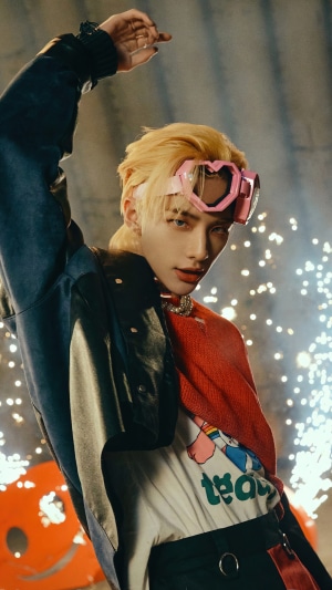 Hyunjin from Stray Kids wearing pink heart goggles
