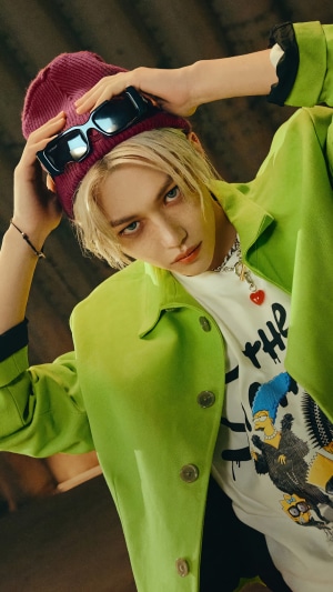 Felix from Stray Kids in Green Jacket and