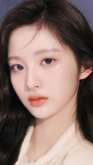 Sullyoon from NMIXX with glitter on her face