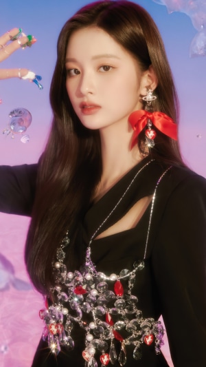 Sullyoon from NMIXX with red bow earrings