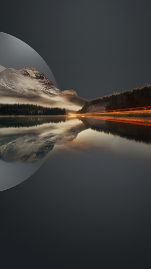 Mountain lake with reflection and light trails