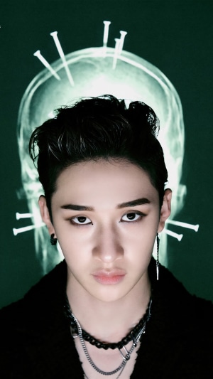 Bang Chan from Stray Kids with X-ray skull background