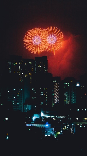 Fireworks over a city at night