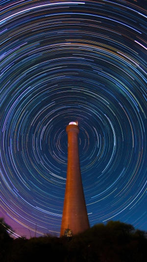 Lighthouse with star trails at night in Australia