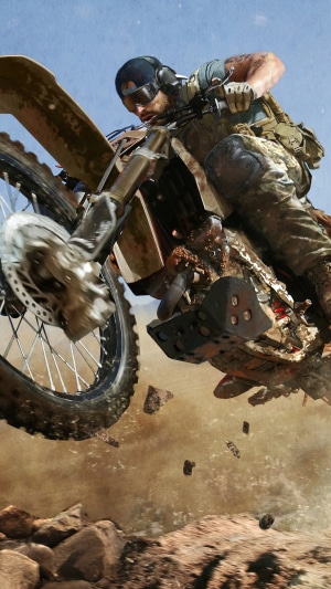 Nomad from Ghost Recon Wildlands riding a dirt bike