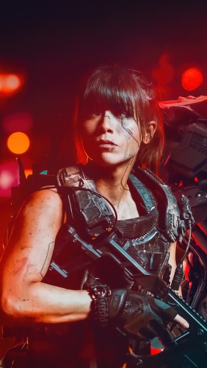 Woman in Sci-Fi Soldier Armor Holding a Rifle