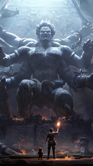 Giant stone ogre statue with a person and dog