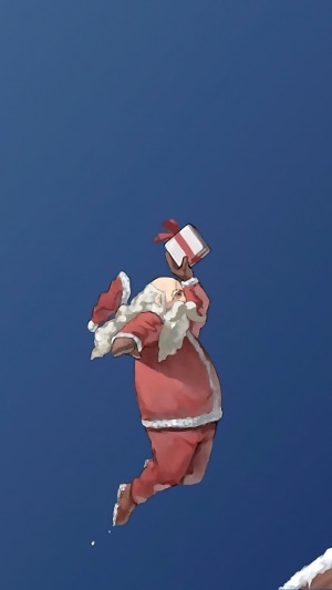 Santa Claus jumping with a gift