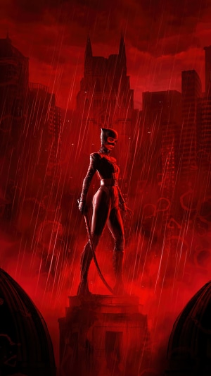 Catwoman from The Batman (2022) in a red, rainy city