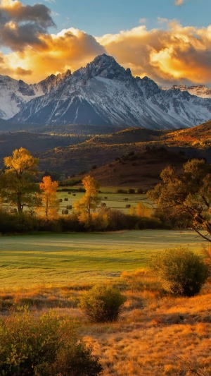 Autumn mountain landscape with hay bales