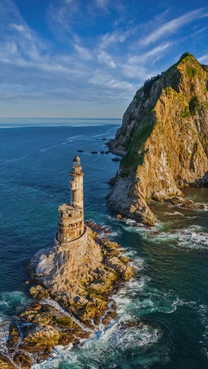 Lighthouse on a rocky island in Russia