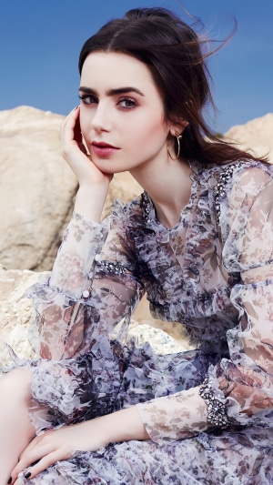 Lily Collins in a floral dress outdoors