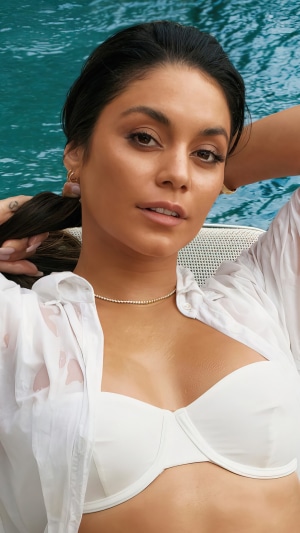 Vanessa Hudgens posing by a pool