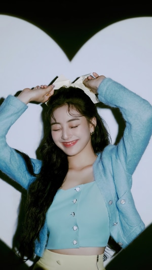 Jihyo from TWICE with a bow