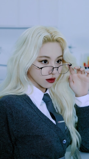 Chaeyoung from TWICE wearing glasses and a school uniform