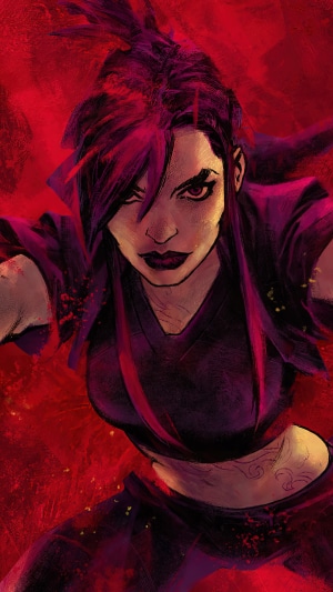A woman with dark hair and red streaks in a dark outfit