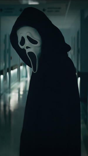 Ghostface from Scream in a dark hospital hallway