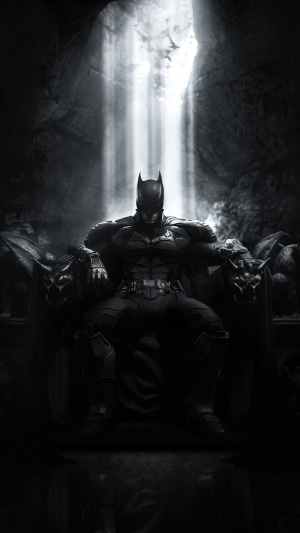 Batman sitting on a throne in a cave