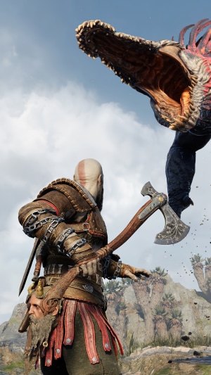 Kratos from God of War Ragnarok fighting a monster