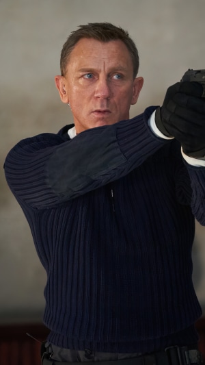 James Bond from No Time To Die holding a gun