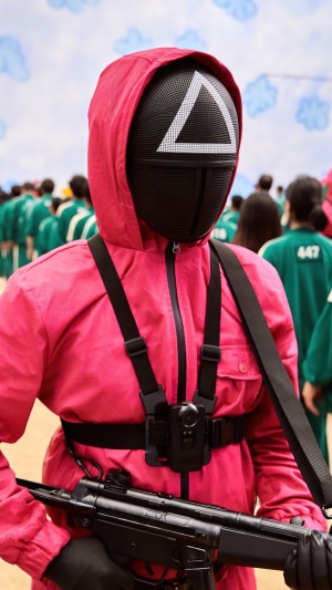Squid Game Guard with Triangle Mask and Gun