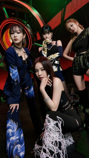 Aespa members in futuristic outfits