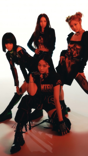 Aespa members posing in dark outfits