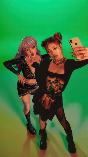 Aespa Ningning and virtual avatar Karina taking a selfie