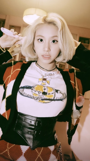 Chaeyoung from TWICE posing with a brush