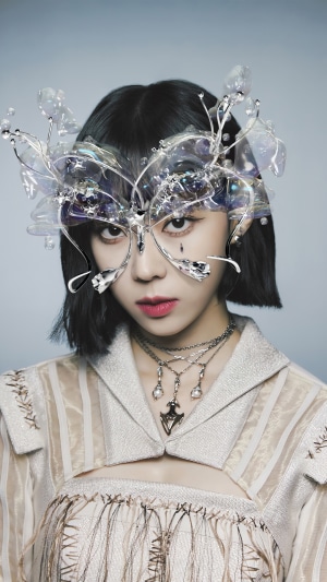 Winter from Aespa wearing a mask and necklaces