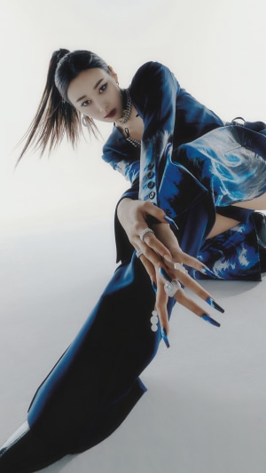 Giselle from Aespa posing in a blue outfit