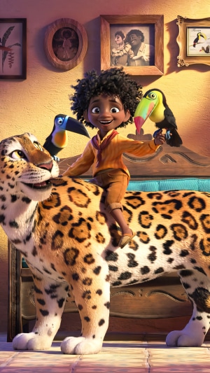 Antonio Madrigal from Encanto riding a jaguar with toucans