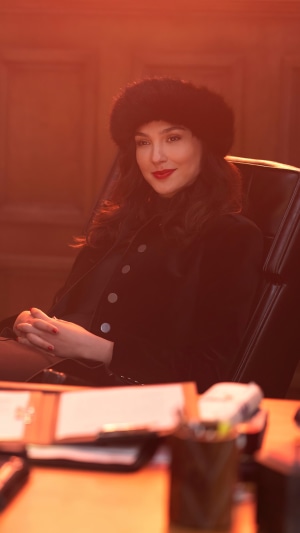 Gal Gadot as a woman in a fur hat in Red Notice