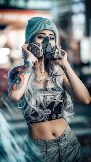 Girl in Gas Mask with Tattoos and Beanie