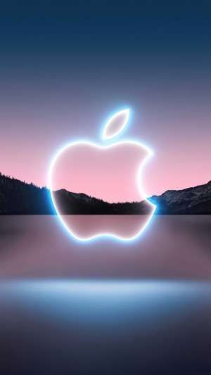 Apple logo over a lake and mountains