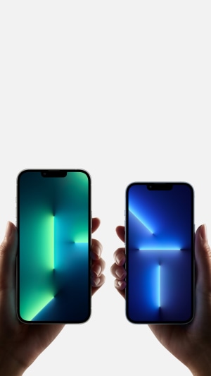 Two iPhones held by hands