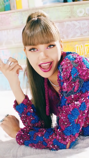 Lisa from BLACKPINK in colorful outfit